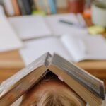 E-readers - Person in White Shirt With Brown Wooden Frame