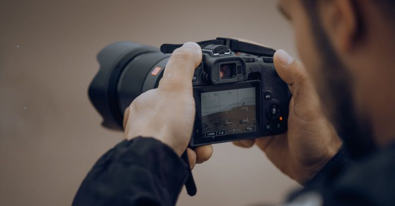 Digital Overwhelm - A man is taking a picture with his camera