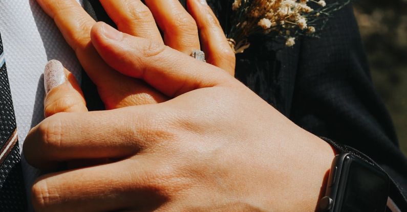 Smartwatches - A man and woman holding hands in a wedding dress