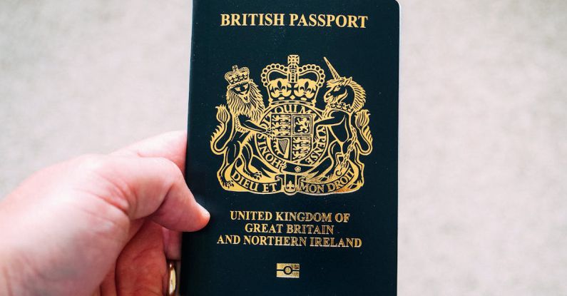 Biometrics - Crop unrecognizable person demonstrating British passport