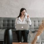 Educational Software - Woman Drinking Coffee While Working With Laptop